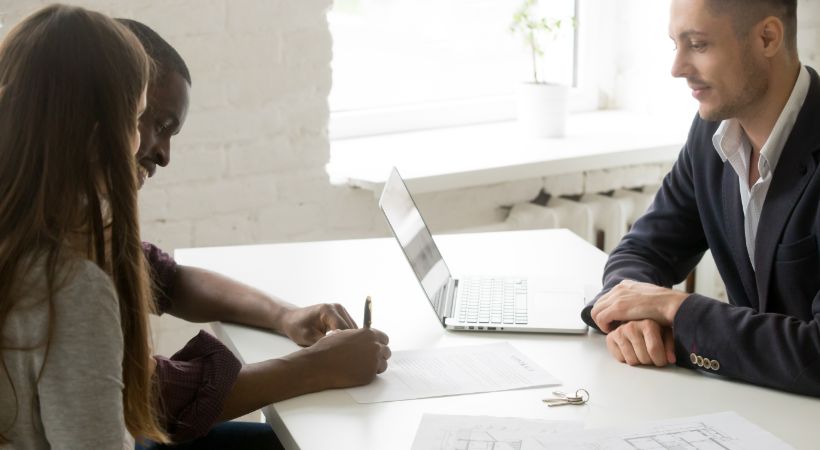Estate agent helping with paperwork