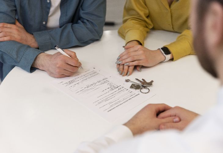 Tenants reviewing and signing tenancy conditions