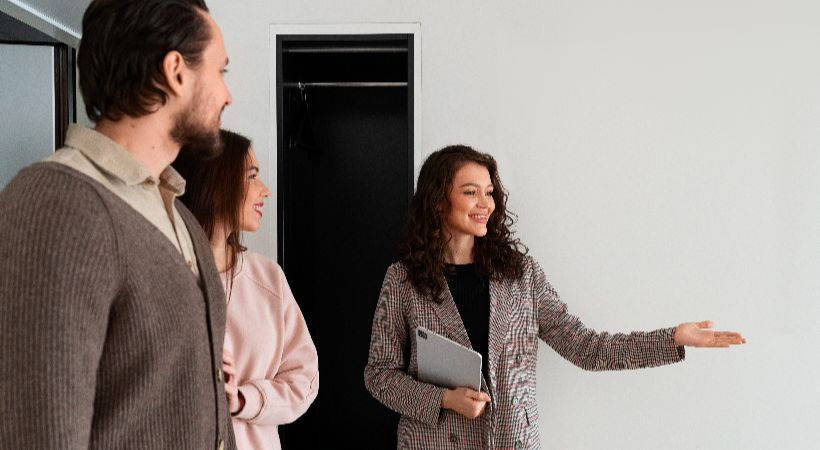 estate agent showing someone around a property