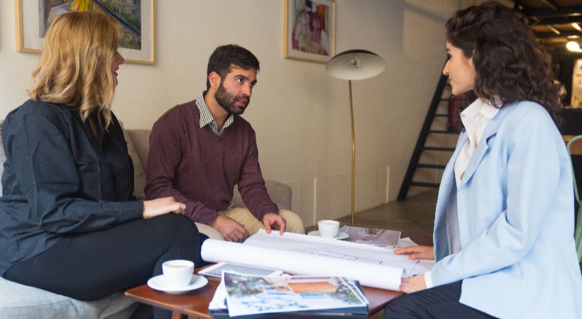 Someone meeting with an estate agent