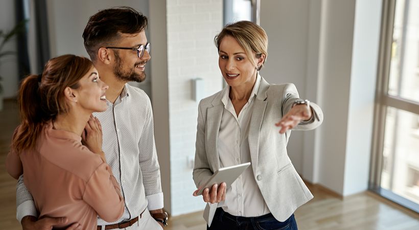 Estate agent showing potential buyers around a property