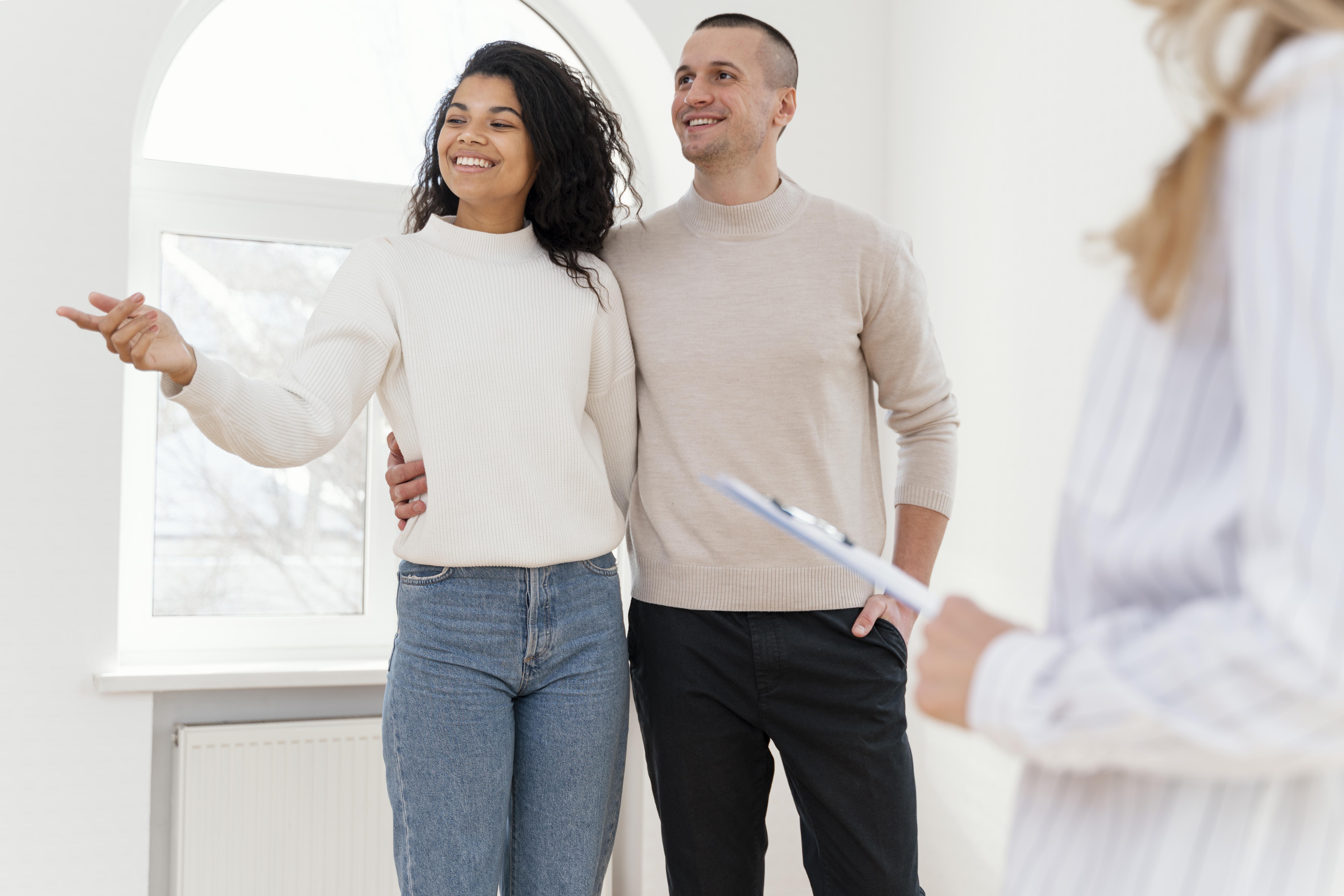 Couple being showed around a property